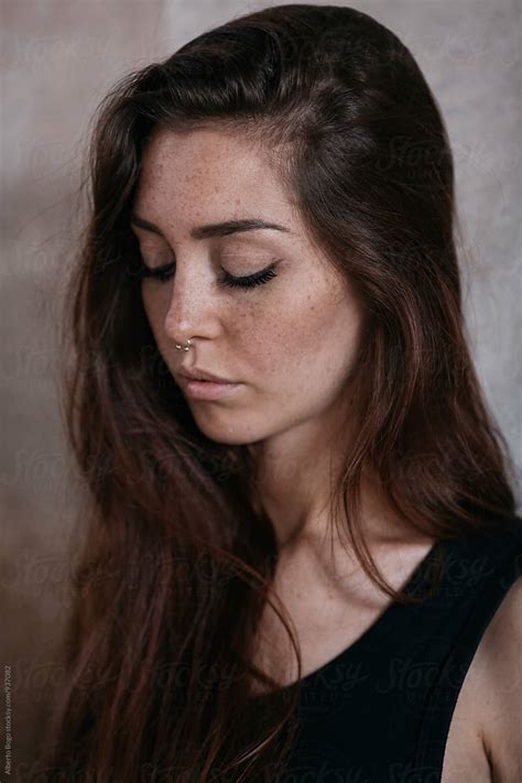Close Up Of Freckled Woman With Eyes Closed By Stocksy Contributor
