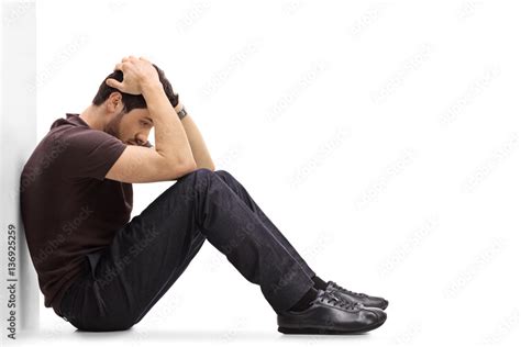 Depressed Man Sitting On The Floor With His Head Down Stock Foto