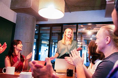 Millennial Female Executive Being Applauded After A Speech During A