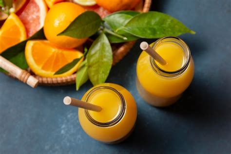 Free Photo Top View Orange Juice With Citrus Mix