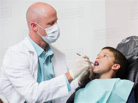 Dentist Checking Mouth Of Patient 12 13 Stock Photo Dissolve