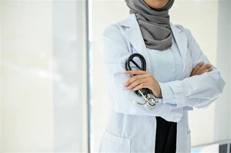 Premium Photo Professional Muslim Female Doctor In Uniform And Hijab