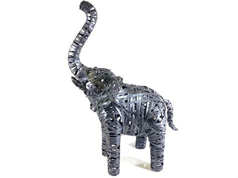 Large Grey Metal Elephant Standing Statue Check out our large elephant statue selection for the very best in unique or custom, handmade pieces from our statues shops.