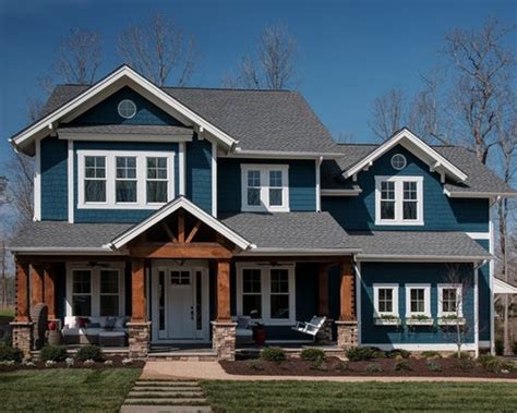 New custom home with natural wood shingle siding. Craftsman Blue Exterior Home Design Ideas, Remodels & Photos