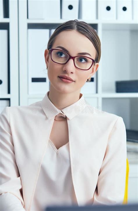 Portrait Of Caucasian Attractive Business Woman In Glasses At Office