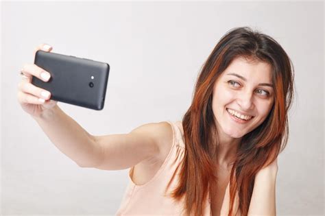 Premium Photo Young Brunette Woman Taking Selfie