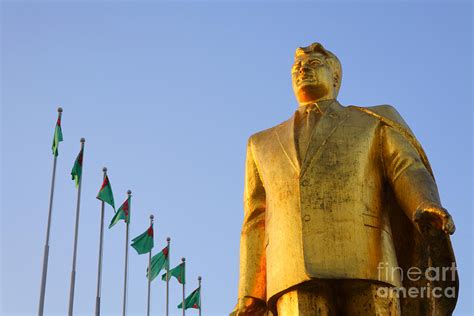 Golden Statue Of Niyazov In The Park Of Independence In Ashgabat
