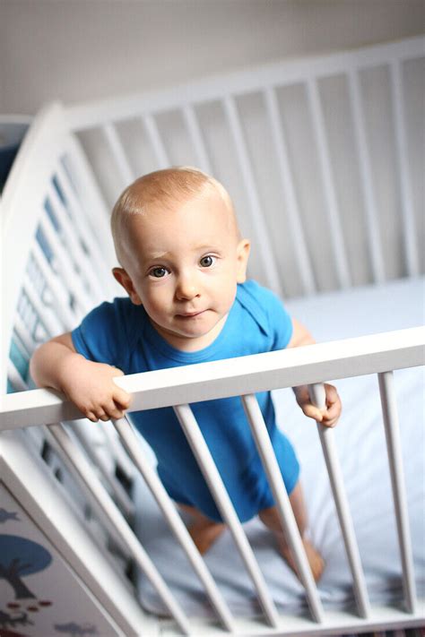 Baby Boy Standing In His Crib License Image 71027410 Lookphotos