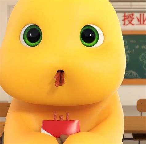 An Animated Character With Green Eyes Holding A Red Object In Front Of