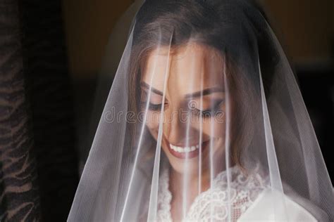 Gorgeous Beautiful Bride Smiling In Silk Robe Under Veil Posin Stock