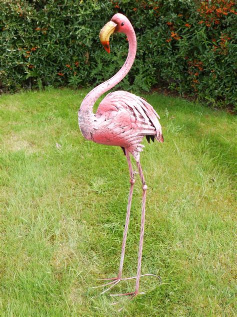 The flamingo planters add a touch of whimsy to my herb garden. Pin on Garden