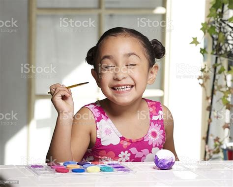 Little Girl Painting An Easter Egg Stock Photo Download Image Now