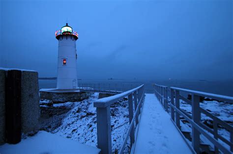 Lighthouse With Christmas Lights By Jeremy Dentremont