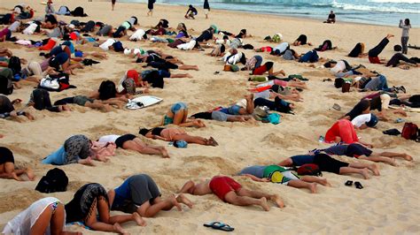 400 People Bury Their Heads In The Sand To Protest Australian Prime