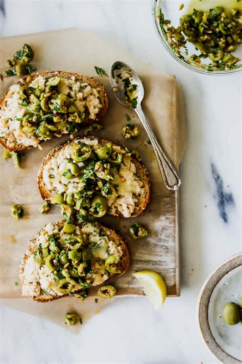 Someone sent me tuna in olive oil from a delicatessen shop via post in a box. Cheesy Tuna Toasts with Olive Salsa | Dishing Out Health