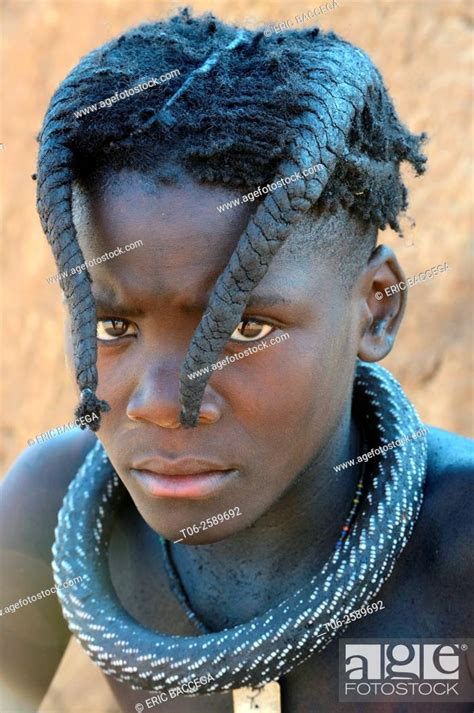Himba Girl With The Typical Necklace And Double Plait Hairstyle Of The