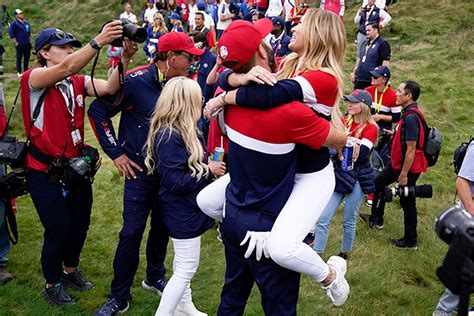 Paulina Gretzky Jumps Into Dustin Johnsons Arms And Kisses Him After