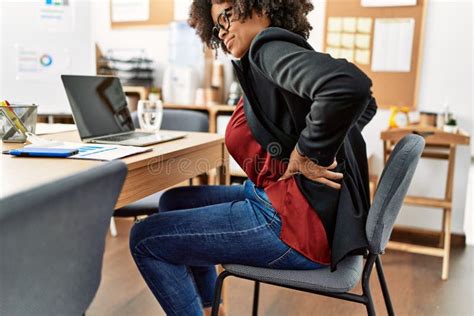 Young African American Woman Suffering For Backache Working At Office