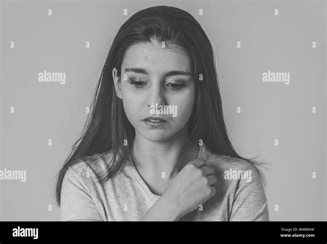 Black And White Portrait Of A Young Sad Woman Serious And Concerned Looking Worried And