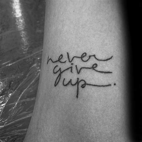60 Never Give Up Tattoos For Men Phrase Design Ideas