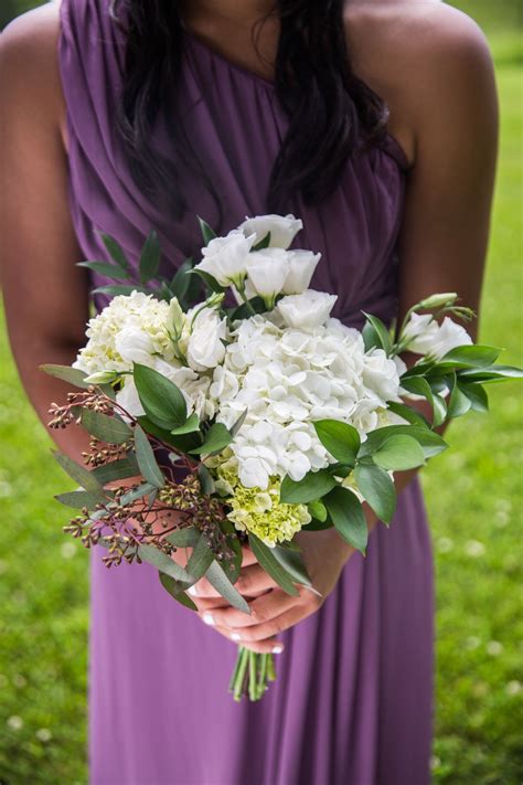 A bold and cool wedding bouquet of burgundy and white roses, blush ones, white anemones, seed pods and thistles, greenery for the fall. White Rose and Eucalyptus Bouquets | Gold wedding bouquets ...
