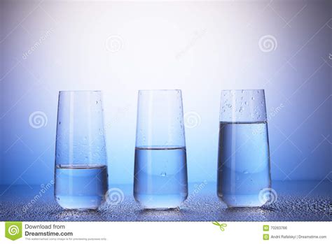 One Third Half Filled And Two Thirds Full Drinking Glasses Stock Photo