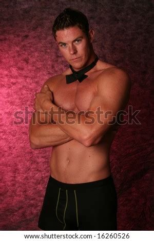 Handsome Sexy Male Gigolo Stripper Studio Shot With Black Bow Tie Stock
