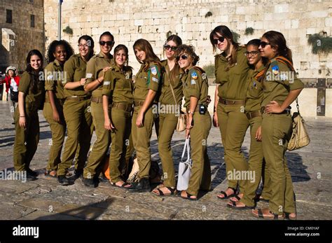 A Group Of Female Idf Soldiers Pose For A Photo At The Western Wall