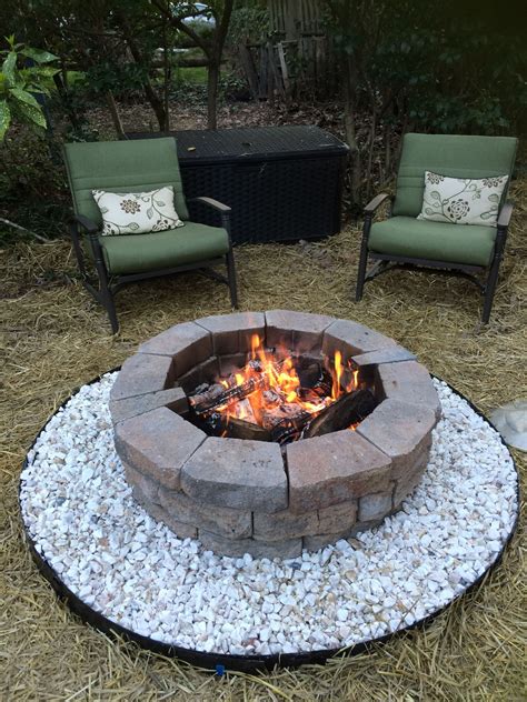 White Stones Around The Fire Pit Are A Great Addition To Highlight This