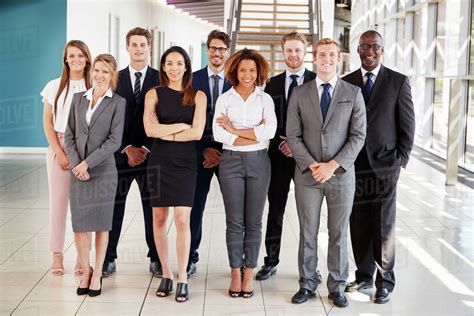 Office Workers In A Modern Lobby Full Length Group Portrait Stock