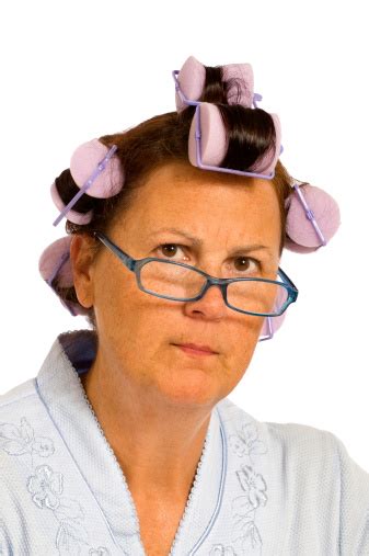 Grumpy Middleaged Woman In Hair Curlers Stock Photo Download Image