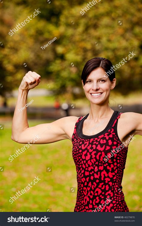 Female Fitness Model Flexing Her Bicep Stock Photo 40279870 Shutterstock