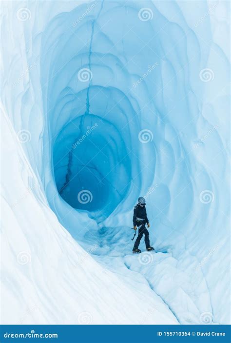 Walking Through An Ice Cave On The Matanuska Glacier In Alaska Stock