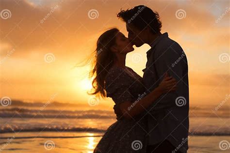 Against The Backdrop Of A Breathtaking Sunset A Deeply In Love Couple
