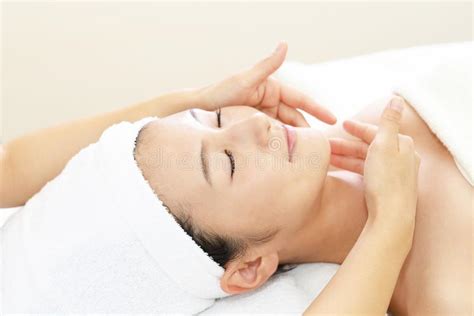 Beautiful Woman Enjoying A Massage In A Spa Center Stock Image Image