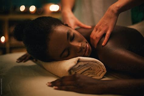 African Woman Enjoying A Massage By Stocksy Contributor Lumina Stocksy