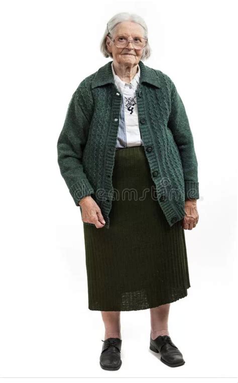 an old woman in a green jacket and skirt