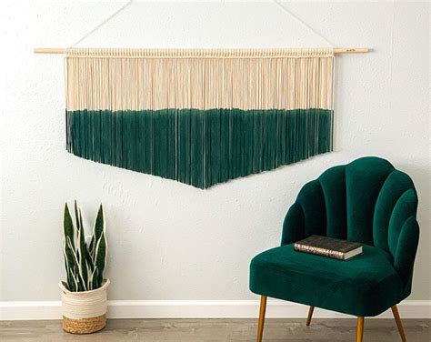 Overall size is 14 wide x 26 long and it is made with gold colore Modern Fiber Art & Bohemian Macrame Wall Hangings by ...
