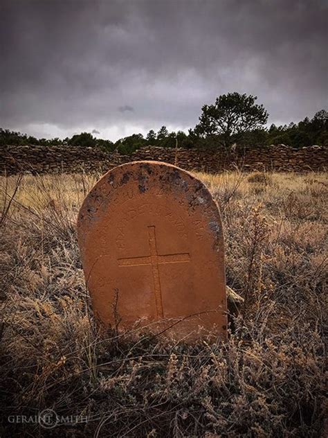 Grave Marker At The Old Cemetery In La Cueva Under A Stormy New Mexico Sky