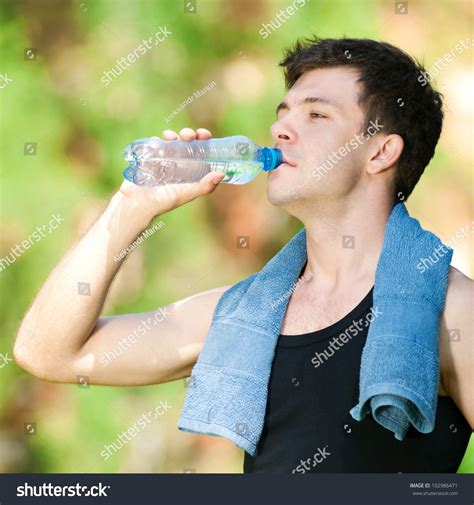 Man Drinking Water After Fitness Exercise Stock Photo