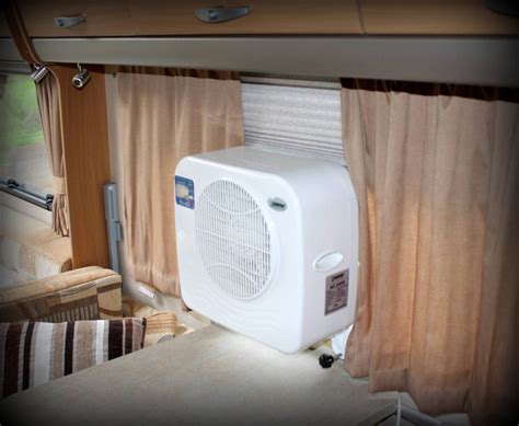 Caravan, motorhome, boat, camper trailer etc. Portable air conditioning unit shown inside Swift ...