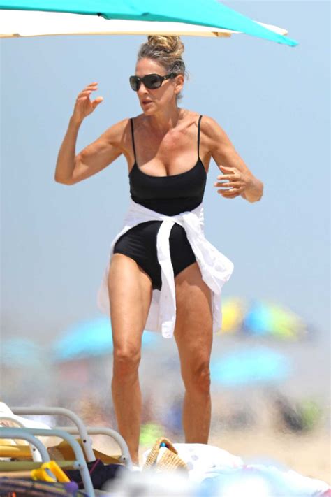 Sarah Jessica Parker In A Black Swimsuit Enjoys A Day At The Beach In The Hamptons New York