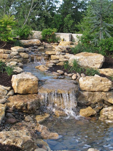 Continuing the use of brick, cadre design & development in philadelphia designed a small koi pond and waterfall for a manayunk row house that adds movement and life to. Enclave Water Feature | Water features in the garden ...