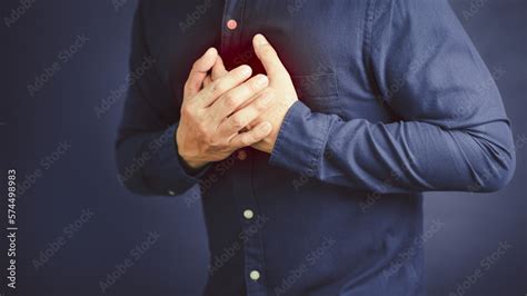Adult Man Suffering From Chest Pain Hand Pressing On Chest With