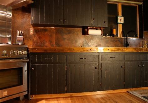 Copper backsplash for a distinctive kitchen with unique ... This beautiful black kitchen by april tomlin interiors is brimming with edgy ideas.