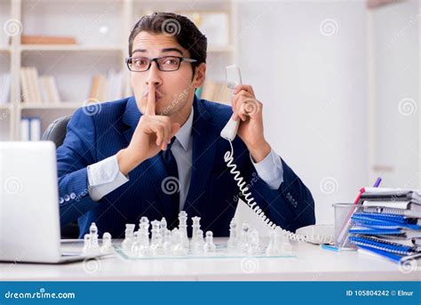 The Young Businessman Playing Glass Chess In Office Stock Photo Image