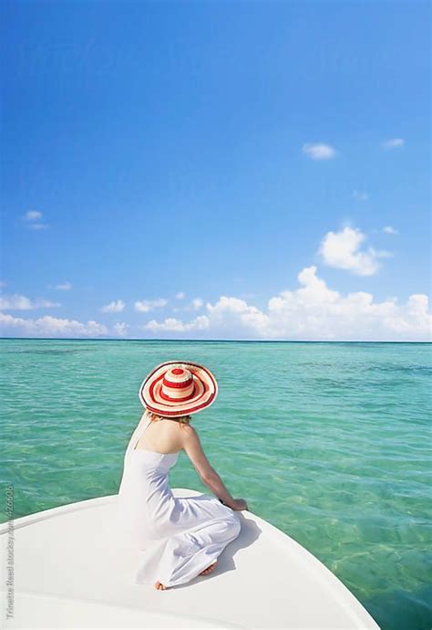 Woman Relaxing On Boat In The Caribbean By Trinette Reed For Stocksy