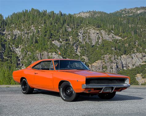 1968 Dodge Charger Rt Orange 34 Front View On Pavement By Trees And