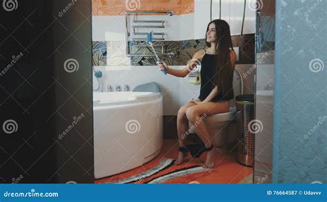 Girl Sitting On Toilet Black Underwear Posing For Selfie On Blue Monopod Stock Video Video