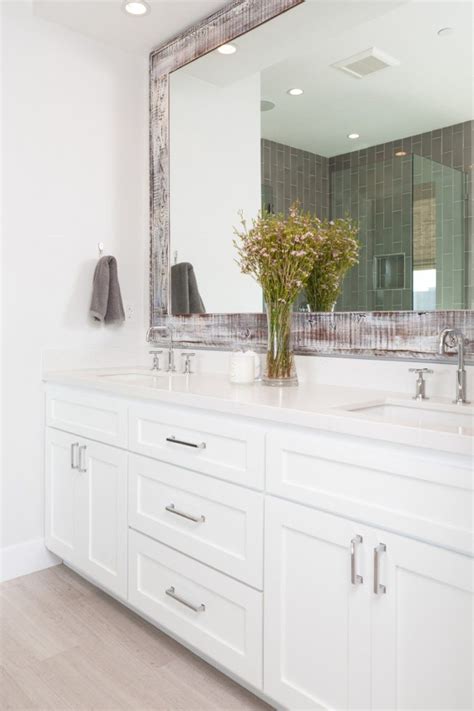 The two mirrors on the front doors appear as one larger mirror for a design that integrates easily into any bath or powder room. Ways To Hang Bathroom Mirrors | White vanity bathroom ...